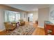 Cozy living room with hardwood floors, a bay window, and comfortable seating area at 3115 Peachtree Ne Dr, Atlanta, GA 30305
