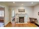 Elegant living room showcasing a fireplace and hardwood flooring with a view to another room at 3115 Peachtree Ne Dr, Atlanta, GA 30305