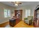 Home office has wooden built-ins, desk, chair and hardwood flooring at 3115 Peachtree Ne Dr, Atlanta, GA 30305