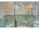 Glass shower with decorative tile and a corner seat offers a luxurious spa-like experience at 3115 Peachtree Ne Dr, Atlanta, GA 30305