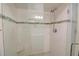 Modern shower with glass enclosure, white subway tile, and a sleek showerhead for a spa-like experience at 3115 Peachtree Ne Dr, Atlanta, GA 30305