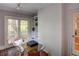 Bright sun room features a glass table, brick wall and decorative mosaic tile floors at 3115 Peachtree Ne Dr, Atlanta, GA 30305