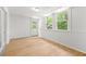Finished basement space features wood floors, white walls, and natural light at 230 Deer Forest Rd, Fayetteville, GA 30214