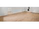 Wood floors extend from the bedroom through an open door to a walk-in closet and an ensuite bathroom at 230 Deer Forest Rd, Fayetteville, GA 30214