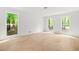 Large bedroom with bright windows and new laminate flooring at 230 Deer Forest Rd, Fayetteville, GA 30214