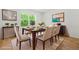 Bright dining room with large windows, neutral decor, and modern furnishings at 230 Deer Forest Rd, Fayetteville, GA 30214