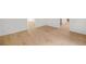 Spacious living room featuring new laminate flooring and white walls at 230 Deer Forest Rd, Fayetteville, GA 30214