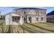 Expansive backyard featuring a brick exterior, covered patio and ample outdoor space for recreation at 322 Delta Dr, Mcdonough, GA 30253