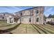 Backyard with brick home and covered patio at 322 Delta Dr, Mcdonough, GA 30253