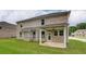 Picture of a stunning brick home featuring a covered patio in the backyard, great for outdoor relaxation and entertainment at 322 Delta Dr, Mcdonough, GA 30253