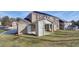 The home's backyard features well-manicured grass and a covered patio, perfect for outdoor gatherings at 322 Delta Dr, Mcdonough, GA 30253