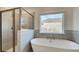 Modern bathroom with a soaker tub and shower at 322 Delta Dr, Mcdonough, GA 30253