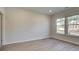 Bright bedroom featuring hardwood floors and large windows, providing ample natural light at 322 Delta Dr, Mcdonough, GA 30253
