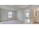 Bright bedroom with neutral walls and carpet flooring at 322 Delta Dr, Mcdonough, GA 30253
