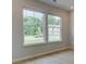Bright room with large windows offering natural light and views of the outdoor scenery at 322 Delta Dr, Mcdonough, GA 30253