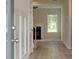 Inviting entryway features paneled walls, and a view of the fireplace in the living space at 322 Delta Dr, Mcdonough, GA 30253