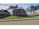 Beautiful two-story brick home with a well-manicured lawn and a classic architectural design at 322 Delta Dr, Mcdonough, GA 30253