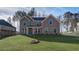 Charming brick home featuring a well-maintained lawn and a covered entryway, perfect for a welcoming feel at 322 Delta Dr, Mcdonough, GA 30253