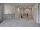Carpeted hallway landing with wood and iron railings and doors to various rooms at 322 Delta Dr, Mcdonough, GA 30253