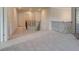 Spacious hallway with carpet flooring and wrought iron banister at 322 Delta Dr, Mcdonough, GA 30253