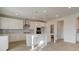 Modern kitchen with stainless appliances, white cabinetry, and island at 322 Delta Dr, Mcdonough, GA 30253