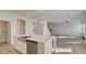 The kitchen features a stainless steel sink, dishwasher, and a center island with pendant lights at 322 Delta Dr, Mcdonough, GA 30253