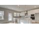 Open-concept kitchen featuring stainless appliances and island counter at 322 Delta Dr, Mcdonough, GA 30253