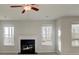 Bright living room features a cozy fireplace and neutral walls at 322 Delta Dr, Mcdonough, GA 30253