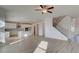 Spacious living room with stairs leading to the second floor and modern kitchen at 322 Delta Dr, Mcdonough, GA 30253