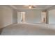 Large main bedroom with ensuite bathroom and views of the upstairs hall at 322 Delta Dr, Mcdonough, GA 30253