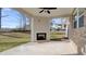 This covered patio features an elegant fireplace, perfect for entertaining or relaxing outdoors at 322 Delta Dr, Mcdonough, GA 30253