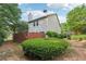 Spacious backyard featuring a well-maintained lawn and mature trees, ideal for outdoor activities at 6071 Apple Grove Rd, Buford, GA 30519