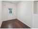 Bright flex space featuring hardwood floors, neutral paint, and a door to the outdoor space at 6071 Apple Grove Rd, Buford, GA 30519