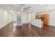 Open-concept living space featuring hardwood floors, stairs, and a view into the kitchen at 6071 Apple Grove Rd, Buford, GA 30519