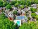 Discover a community of townhomes with tennis courts and a pool nestled among lush greenery at 84 Mount Vernon Cir, Atlanta, GA 30338