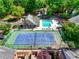 Aerial shot highlighting a community pool, tennis court, clubhouse, and meticulously maintained grounds at 84 Mount Vernon Cir, Atlanta, GA 30338