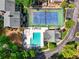 An aerial view showing the pool, tennis courts, lush landscapes and community amenities at 84 Mount Vernon Cir, Atlanta, GA 30338