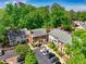 Aerial view of charming homes with manicured lawns, complemented by mature trees and convenient parking at 84 Mount Vernon Cir, Atlanta, GA 30338