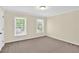 Bedroom with neutral paint, neutral carpet, and two windows for natural light at 84 Mount Vernon Cir, Atlanta, GA 30338