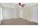 Bedroom with neutral walls, carpet, and ceiling fan at 84 Mount Vernon Cir, Atlanta, GA 30338