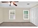 Bedroom with two windows and neutral walls, carpet, and a closet at 84 Mount Vernon Cir, Atlanta, GA 30338