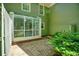Back patio with brick and green siding at 84 Mount Vernon Cir, Atlanta, GA 30338