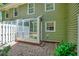 Back patio with brick and green siding at 84 Mount Vernon Cir, Atlanta, GA 30338
