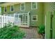 Back patio with brick and green siding at 84 Mount Vernon Cir, Atlanta, GA 30338