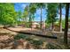 Community playground with swings and other play equipment, surrounded by mature trees and lush landscaping at 84 Mount Vernon Cir, Atlanta, GA 30338