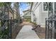 Backyard featuring a brick walkway and lush garden with black wrought iron decoration at 908 N Highland Ne Ave, Atlanta, GA 30306