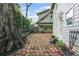 Backyard featuring a brick walkway and garden at 908 N Highland Ne Ave, Atlanta, GA 30306