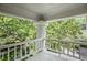 Relaxing balcony with a view of surrounding trees and neighborhood at 908 N Highland Ne Ave, Atlanta, GA 30306
