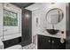Elegant bathroom features a soaking tub, marble countertop and modern lighting at 908 N Highland Ne Ave, Atlanta, GA 30306