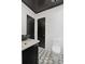 Stylish half bathroom with modern fixtures and patterned tile flooring at 908 N Highland Ne Ave, Atlanta, GA 30306